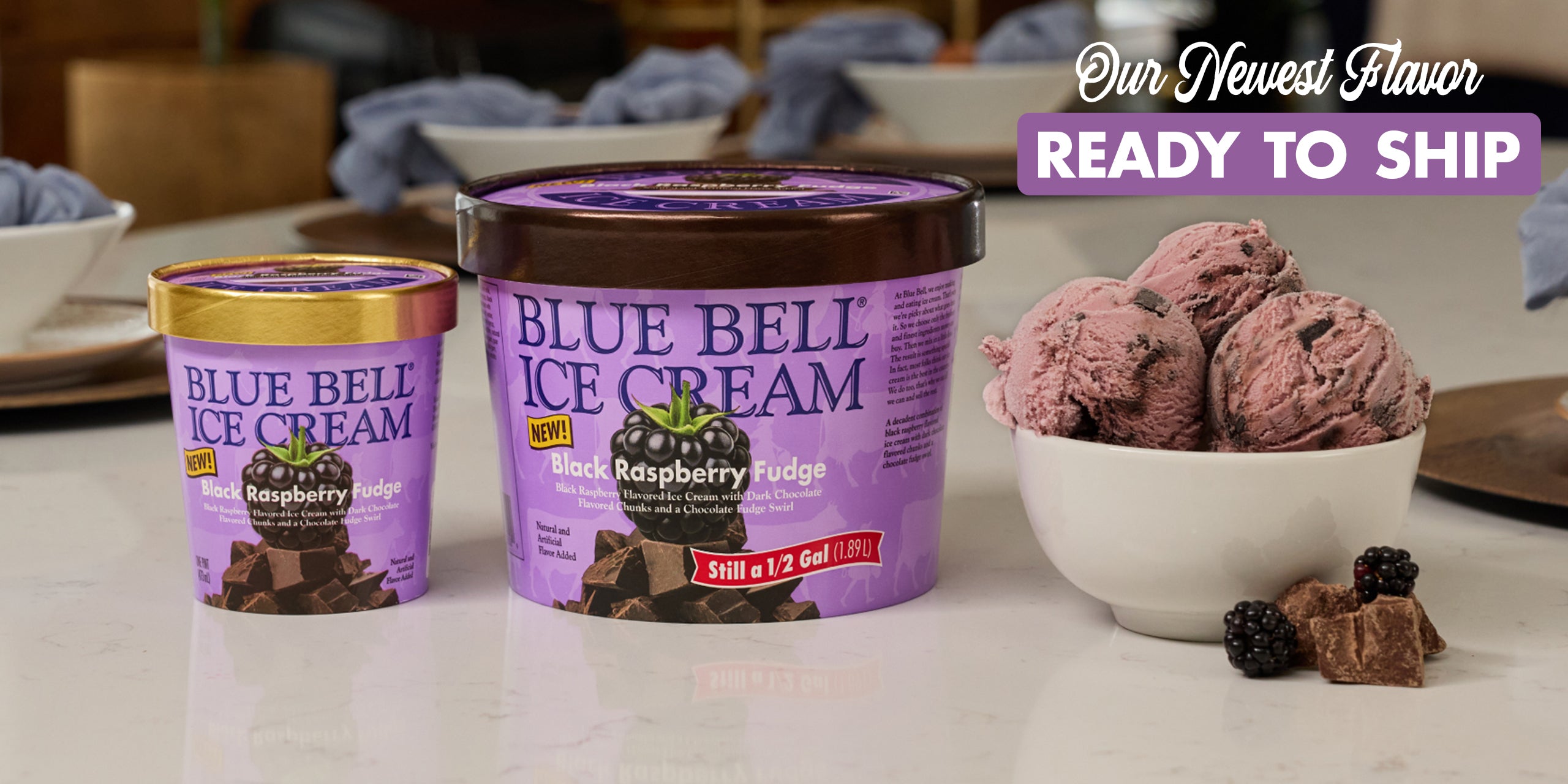 Blue Bell Black Raspberry Fudge Ice Cream with bowl of ice cream on a table, text indicating newest flavor is ready to ship.