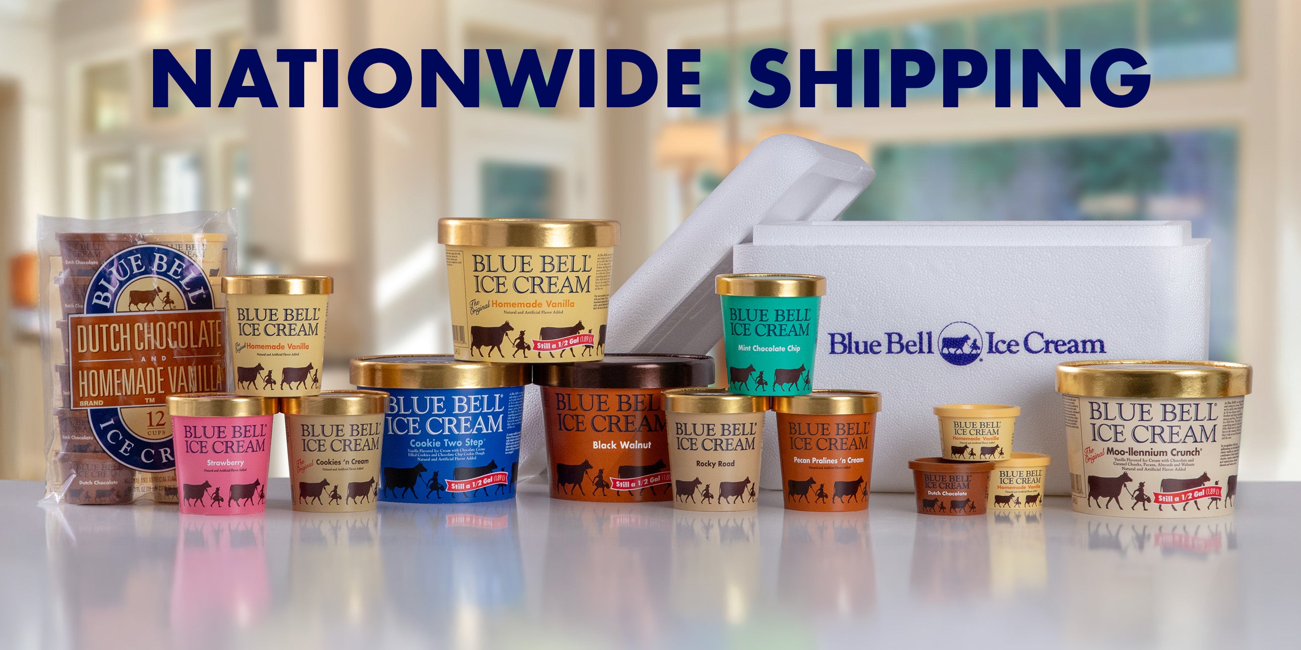 Assorted Blue Bell ice cream containers on a reflective surface with 'Nationwide Shipping' text above.