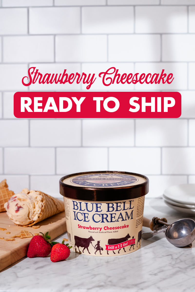 Blue Bell Strawberry Cheesecake Ice Cream now Ready to Ship with a picture of an ice cream carton, strawberries, ice cream cone, dipper and bowls in a kitchen setting